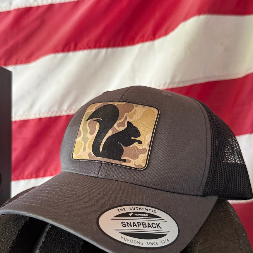 Big Squirrel Duck Camo Patch Trucker Hat in charcoal and black